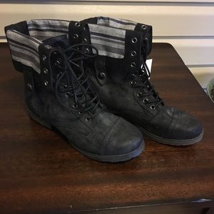 Mid-calf black lace up boot